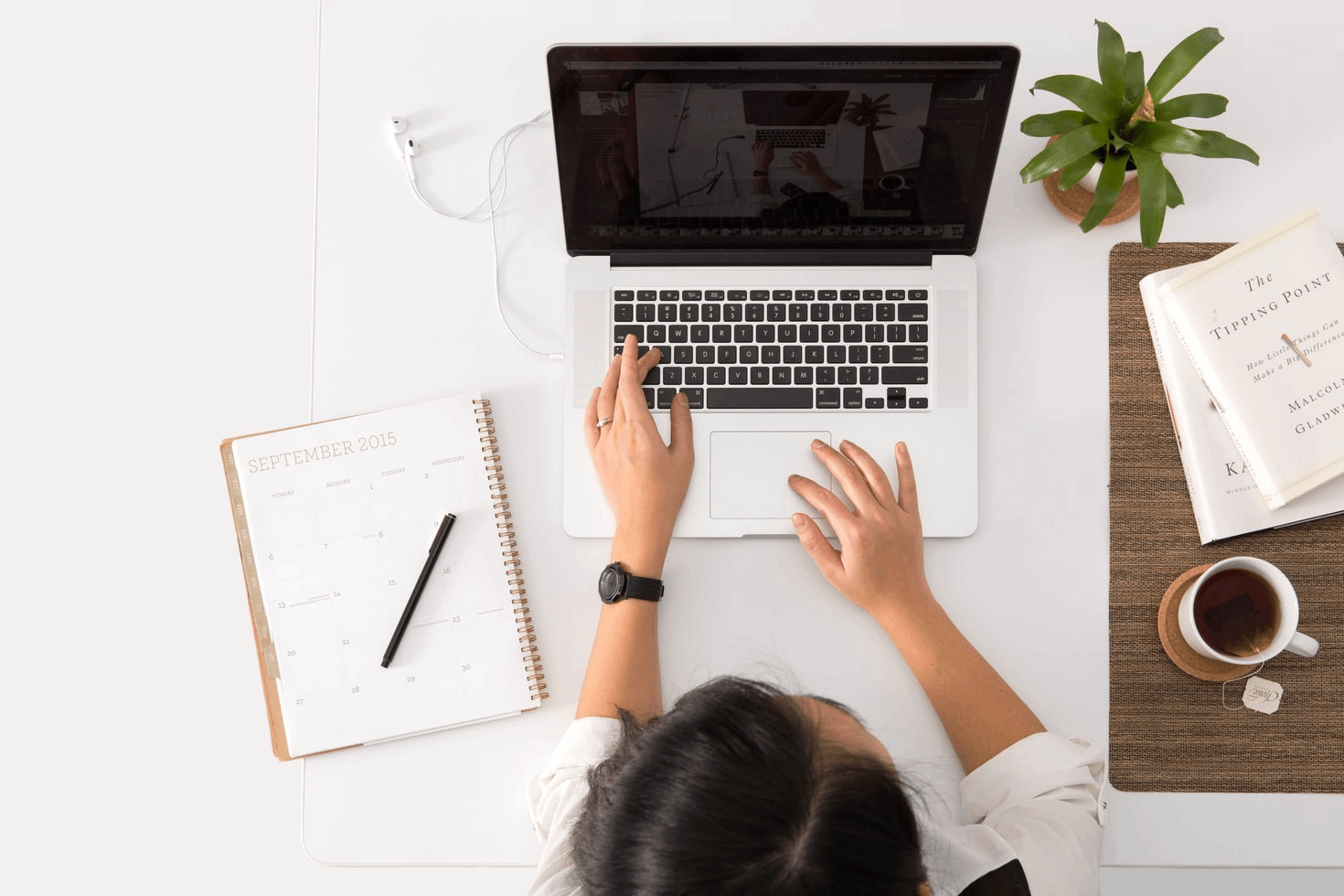 Woman typing on laptop