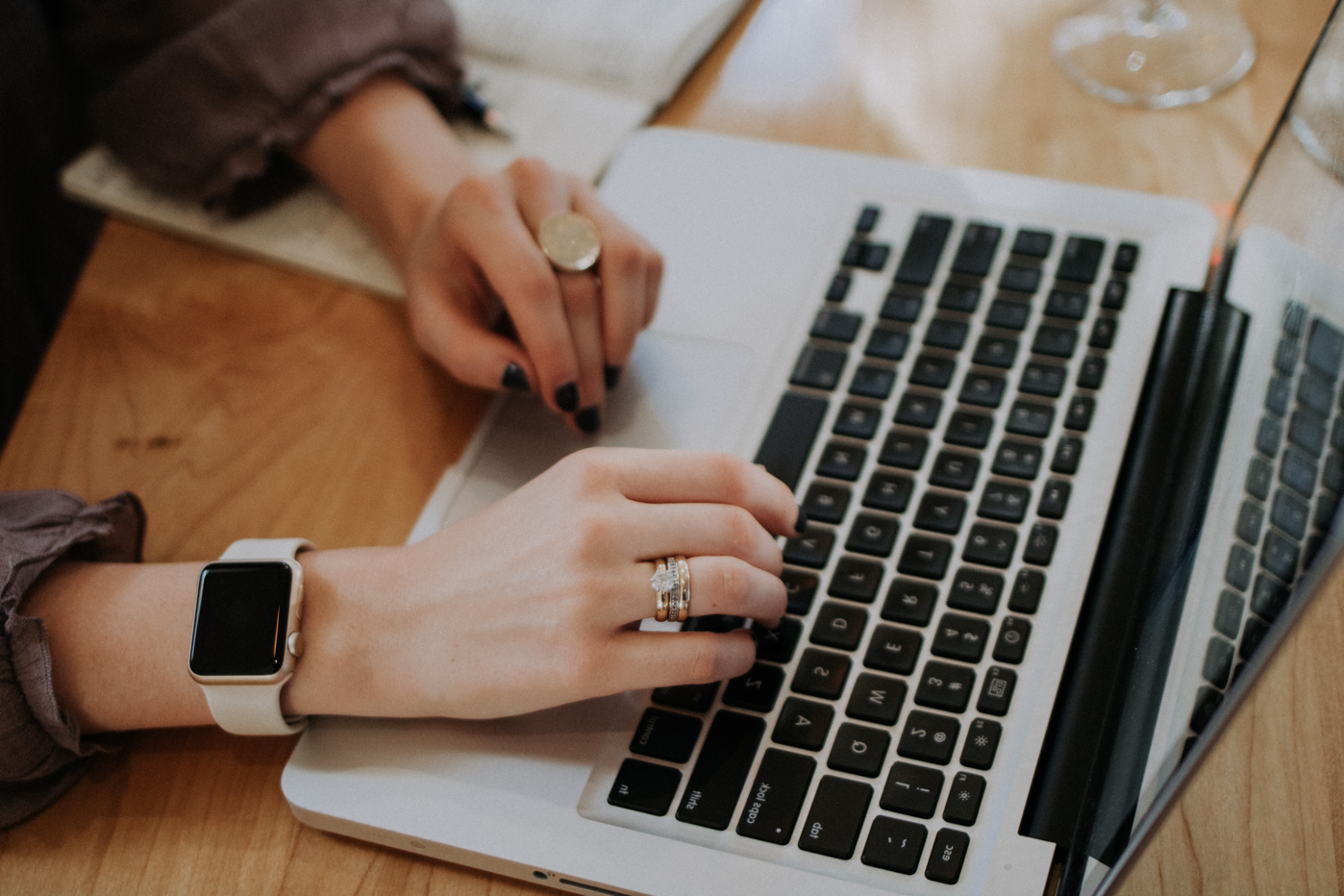 Woman typing on her laptop