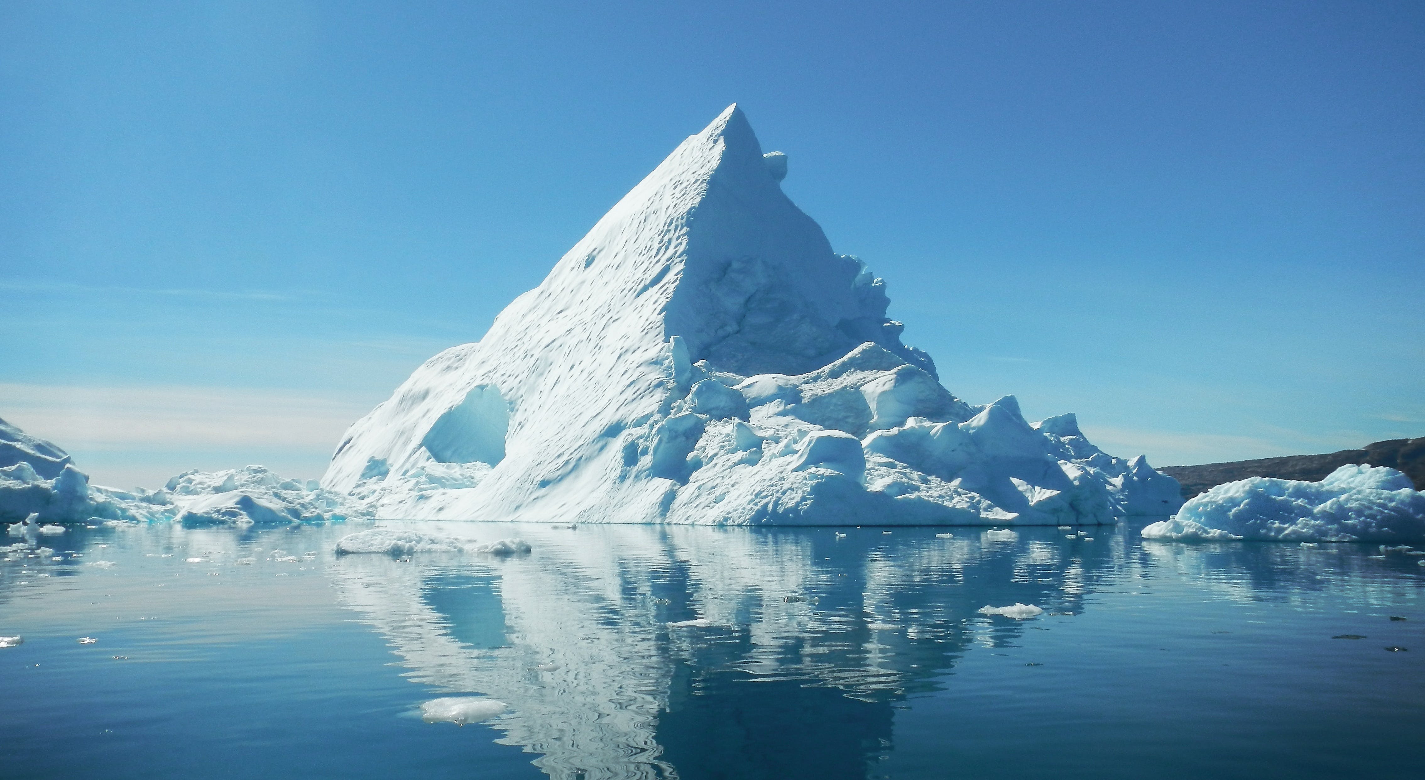 Trianglar shaped iceberg in the sea